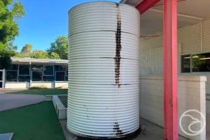 damaged fire tank wall with visible structural defects