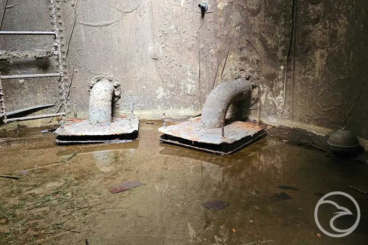 Sediment deposits in an industrial water storage tank