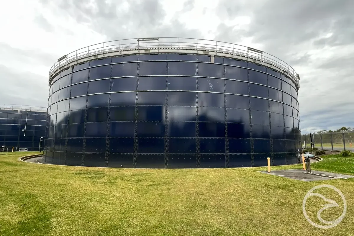 Exterior view of industrial water storage tank under regular maintenance